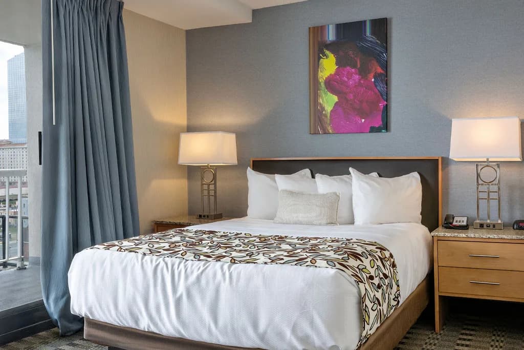 Suite bedroom with a private balcony at the Flagship Resort